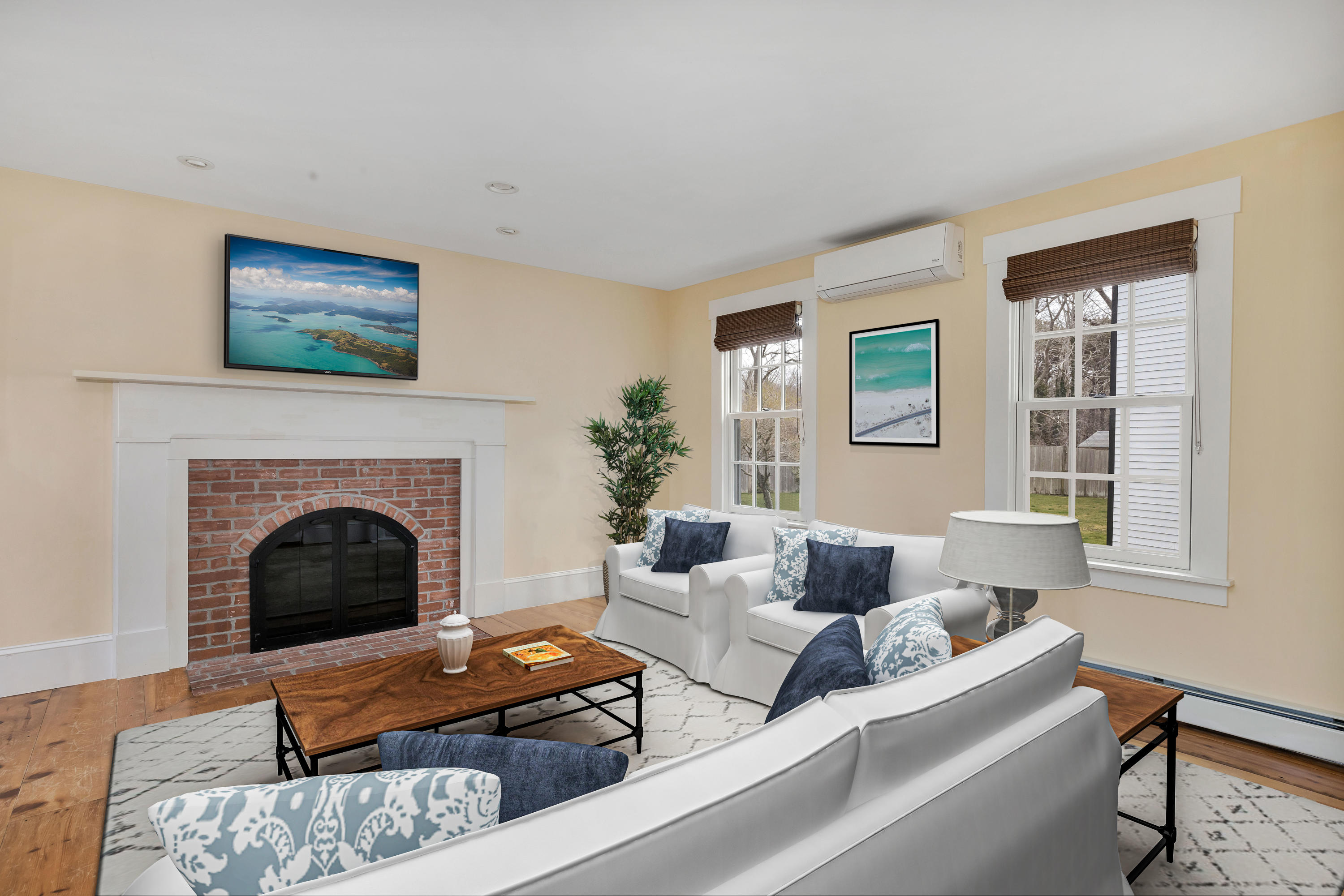 251 Tonset Road Orleans, MA 02653 - Photo 33 of 61 a living room with furniture and a fireplace