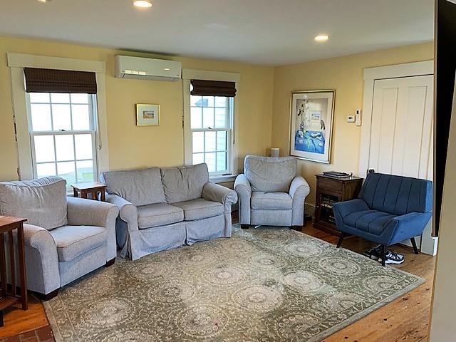 251 Tonset Road Orleans, MA 02653 - Photo 36 of 61 a living room with furniture and a window