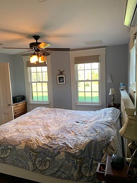 251 Tonset Road Orleans, MA 02653 - Photo 38 of 61 a bedroom with a bed and a window