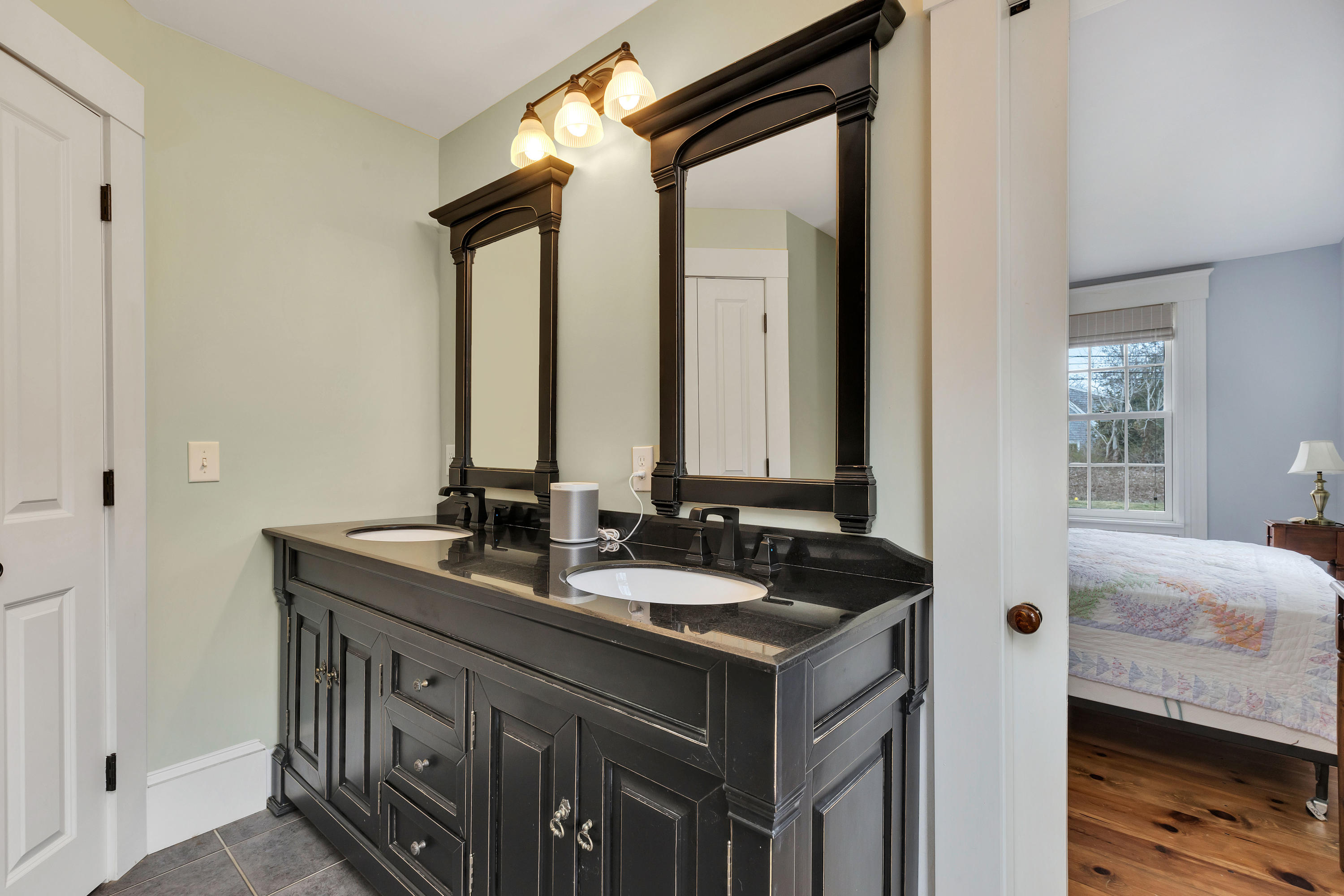 251 Tonset Road Orleans, MA 02653 - Photo 40 of 61 a bathroom with a sink and a mirror