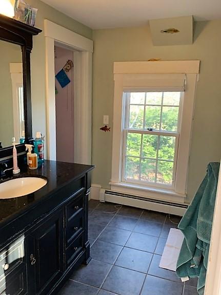 251 Tonset Road Orleans, MA 02653 - Photo 41 of 61 a bathroom with a granite countertop sink a mirror and a bathtub