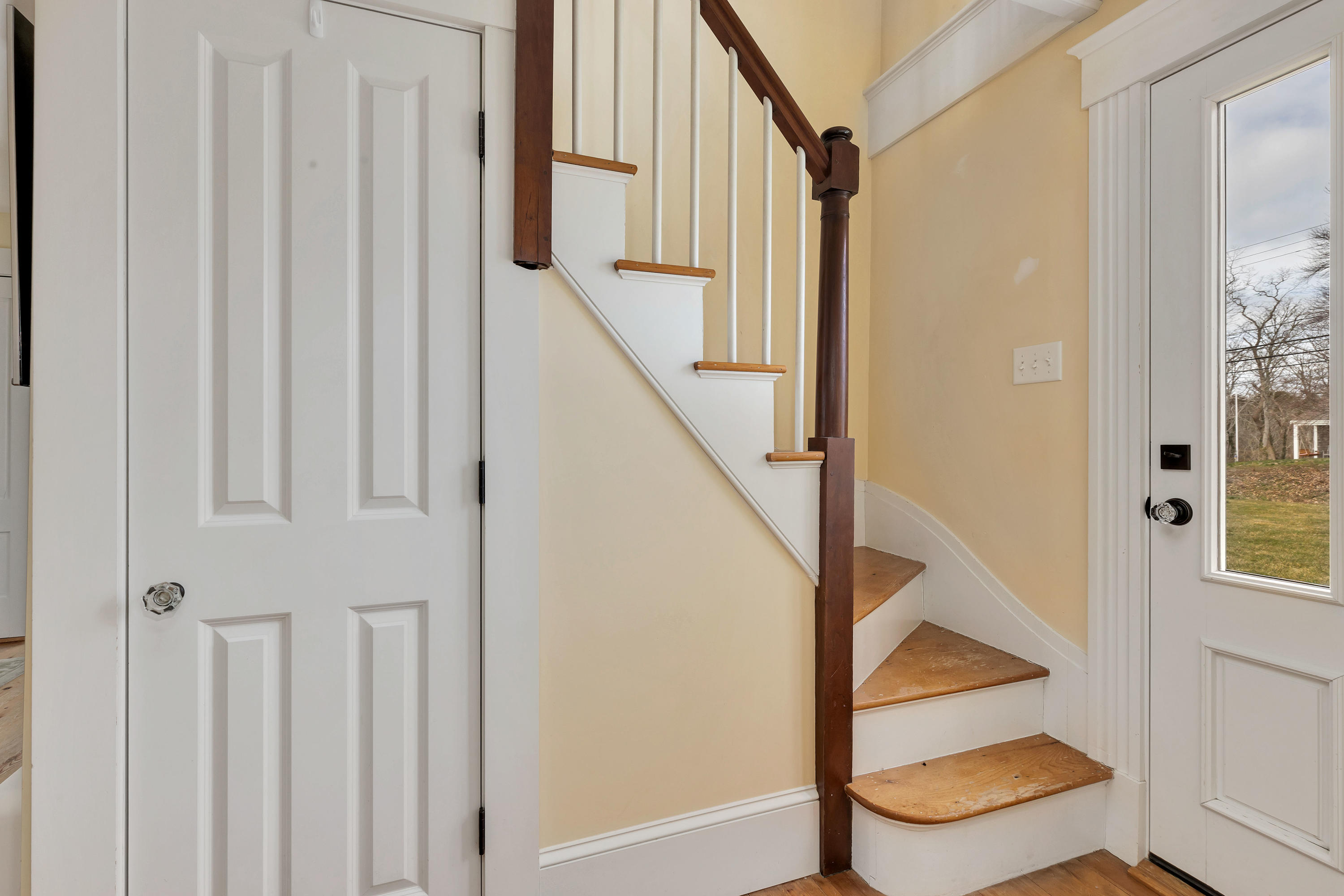 251 Tonset Road Orleans, MA 02653 - Photo 44 of 61 a view of entryway with wooden floor and stairs