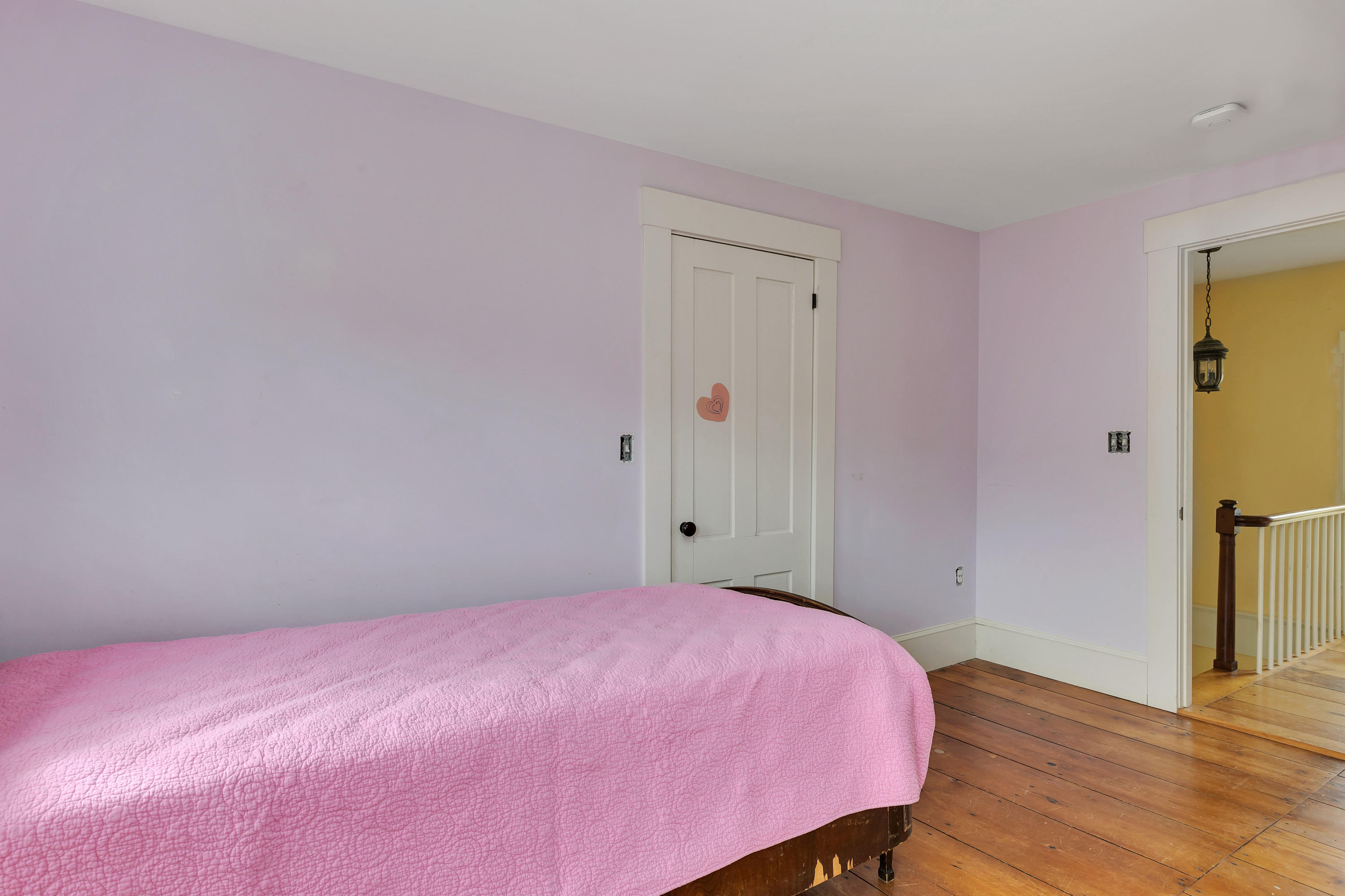 251 Tonset Road Orleans, MA 02653 - Photo 49 of 61 a bedroom with a bed and wooden floor