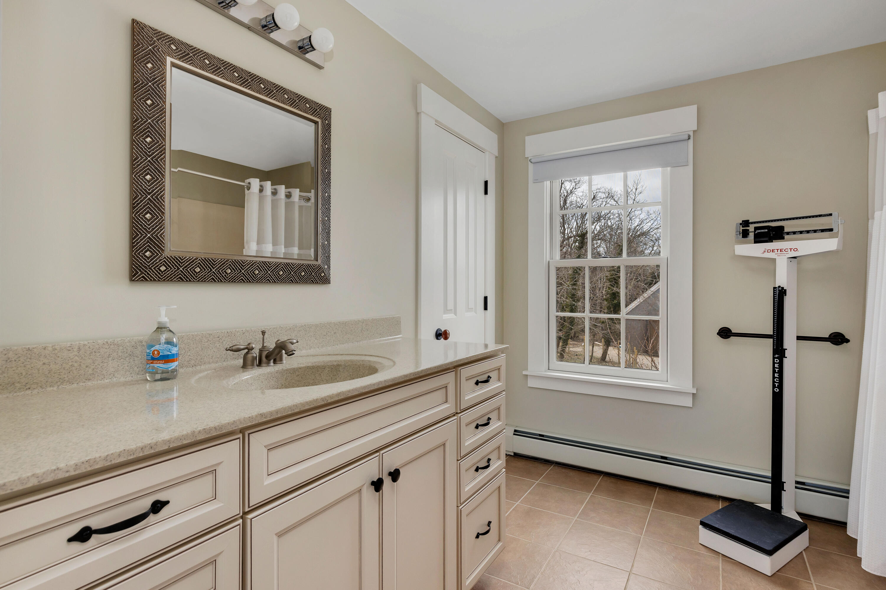 251 Tonset Road Orleans, MA 02653 - Photo 57 of 61 a bathroom with a sink a vanity and a mirror
