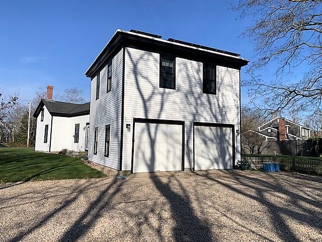 251 Tonset Road Orleans, MA 02653 - Photo 6 of 61 a front view of a house with a yard