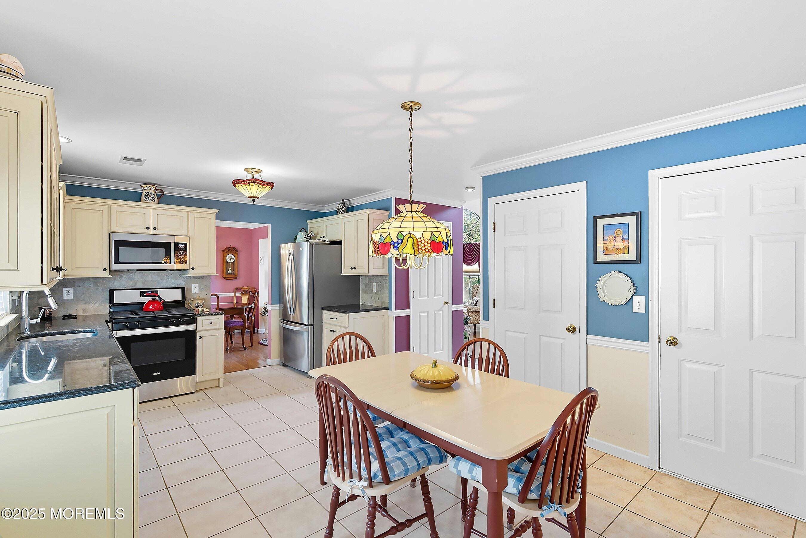1990 Country Trace Toms River, NJ 08753 - Photo 14 of 33 a view of a dining room with furniture and chandelier