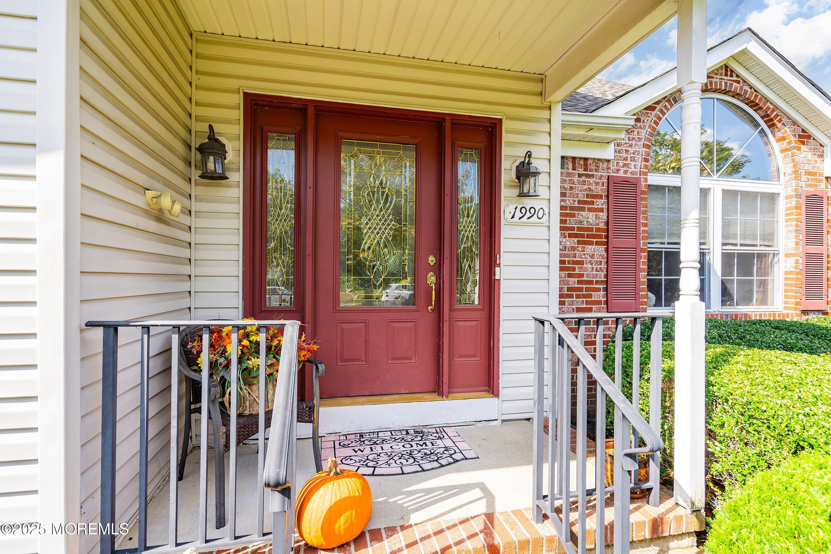 1990 Country Trace Toms River, NJ 08753 - Photo 2 of 33 a front view of a house with a porch