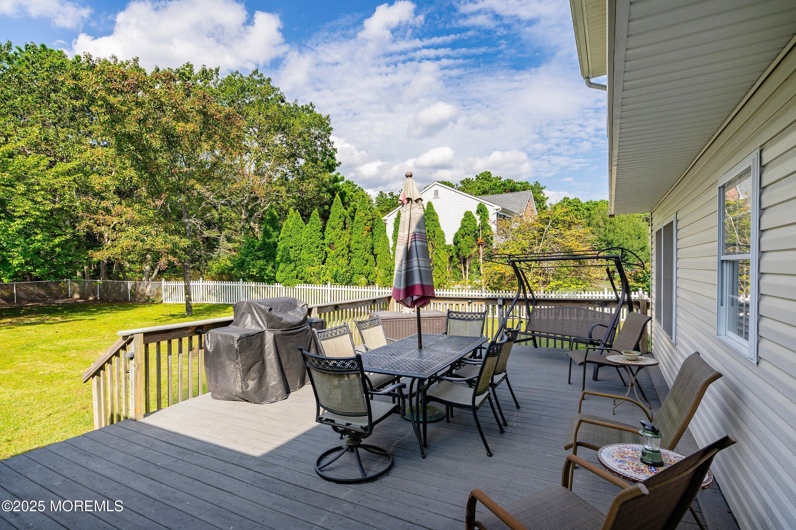 1990 Country Trace Toms River, NJ 08753 - Photo 28 of 33 a view of a patio with a table chairs and a table