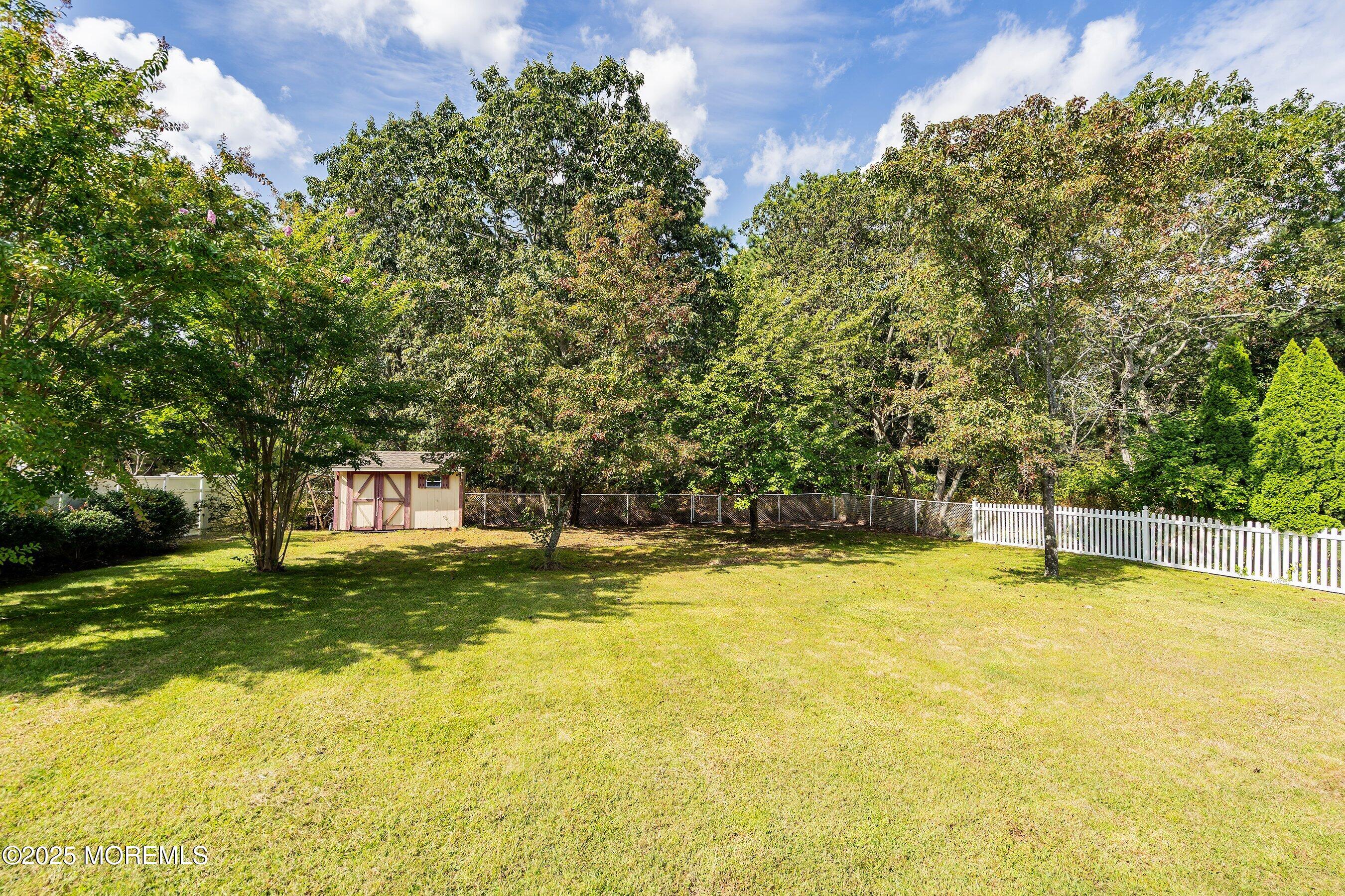1990 Country Trace Toms River, NJ 08753 - Photo 33 of 33 a view of a swimming pool with an outdoor space and seating area