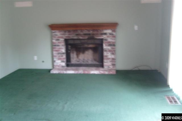 5140 Idlebury Way Reno, NV 89523 - Photo 9 of 9 a living room with a fireplace