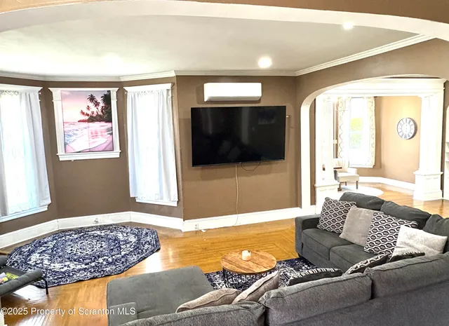 a living room with a couch and a flat screen tv