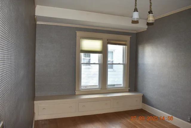 a bathroom with a bathtub and a window