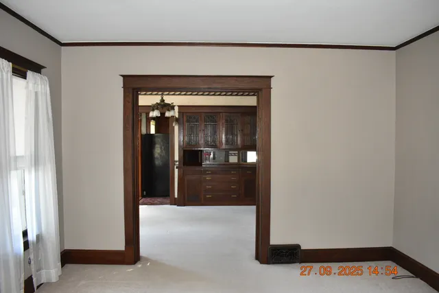 a view of hallway with bathroom