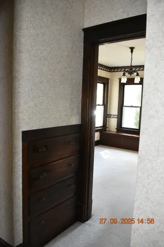 a view of empty room with windows