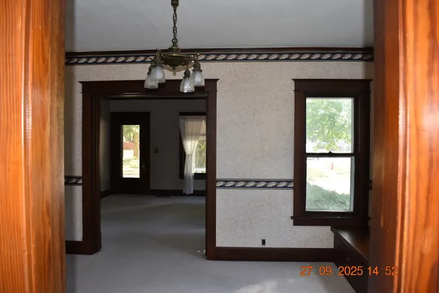 a view of a hallway with a window