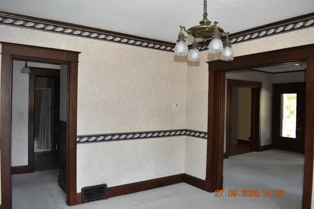 a view of a room that has a large window