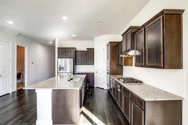 a view of a livingroom with an entryway and a window