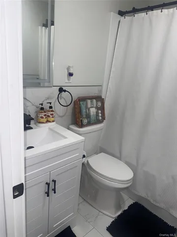 a bathroom with a toilet and sink