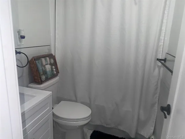 a bathroom with a toilet and a sink