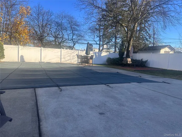 a view of backyard and tree