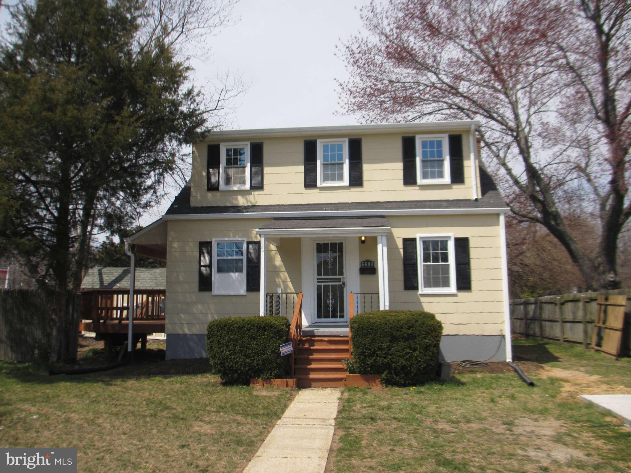 6600 Poplar Road Morningside, MD 20746 - Photo 1 of 13 a front view of a house with a yard