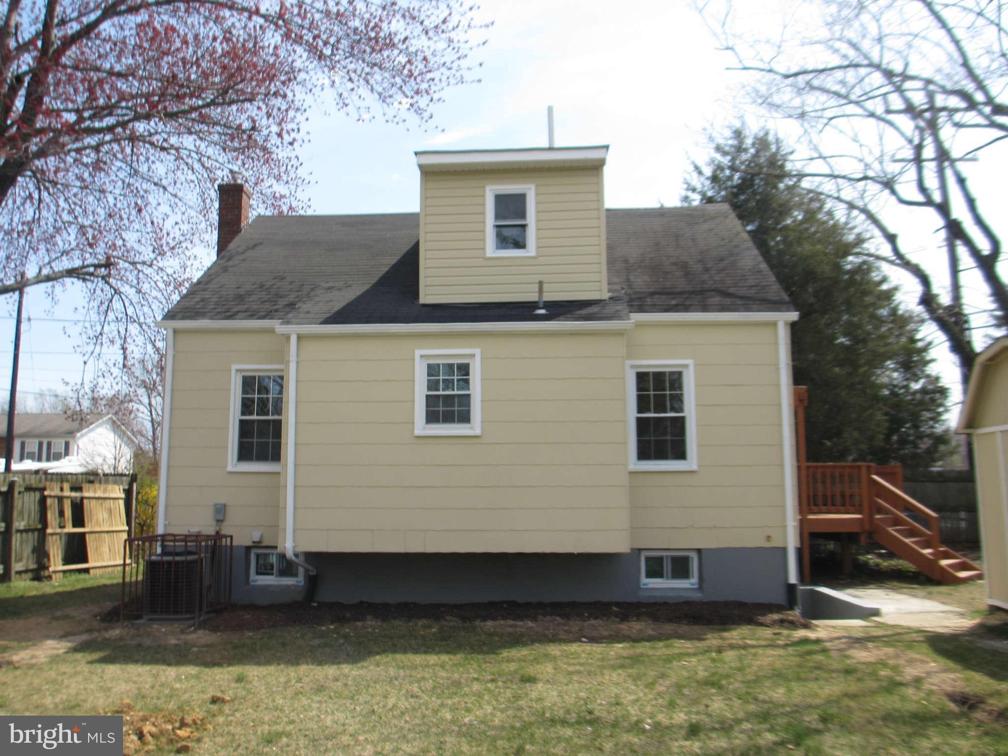 6600 Poplar Road Morningside, MD 20746 - Photo 2 of 13 a front view of a house with a yard