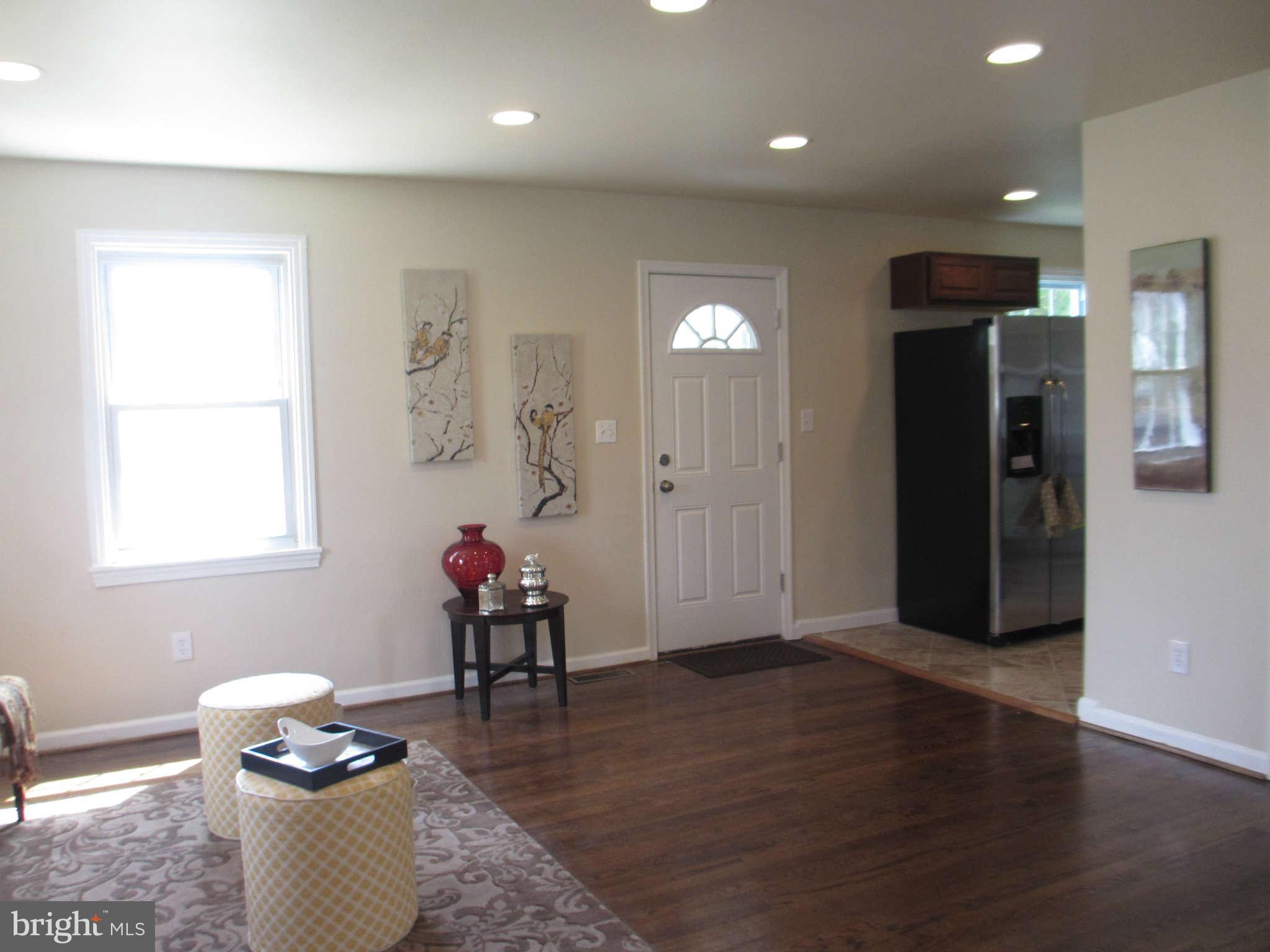 6600 Poplar Road Morningside, MD 20746 - Photo 11 of 13 a living room with hard wood flooring