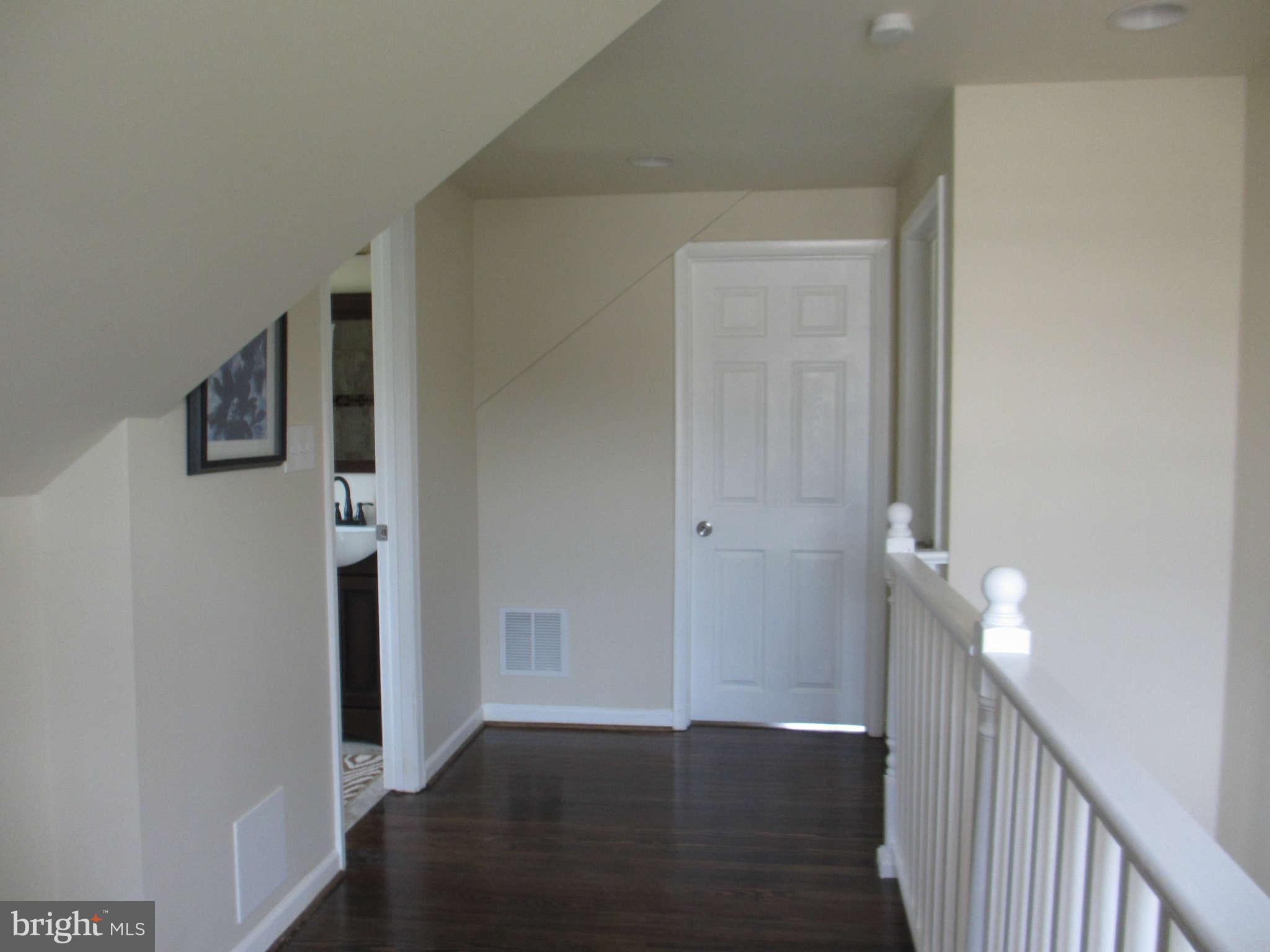 6600 Poplar Road Morningside, MD 20746 - Photo 3 of 13 a view of a hallway with wooden floor