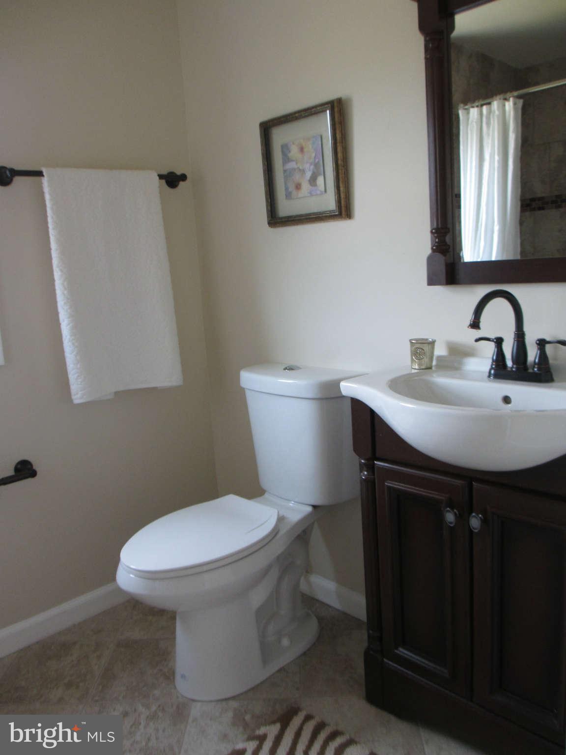 6600 Poplar Road Morningside, MD 20746 - Photo 8 of 13 a bathroom with a sink toilet and mirror