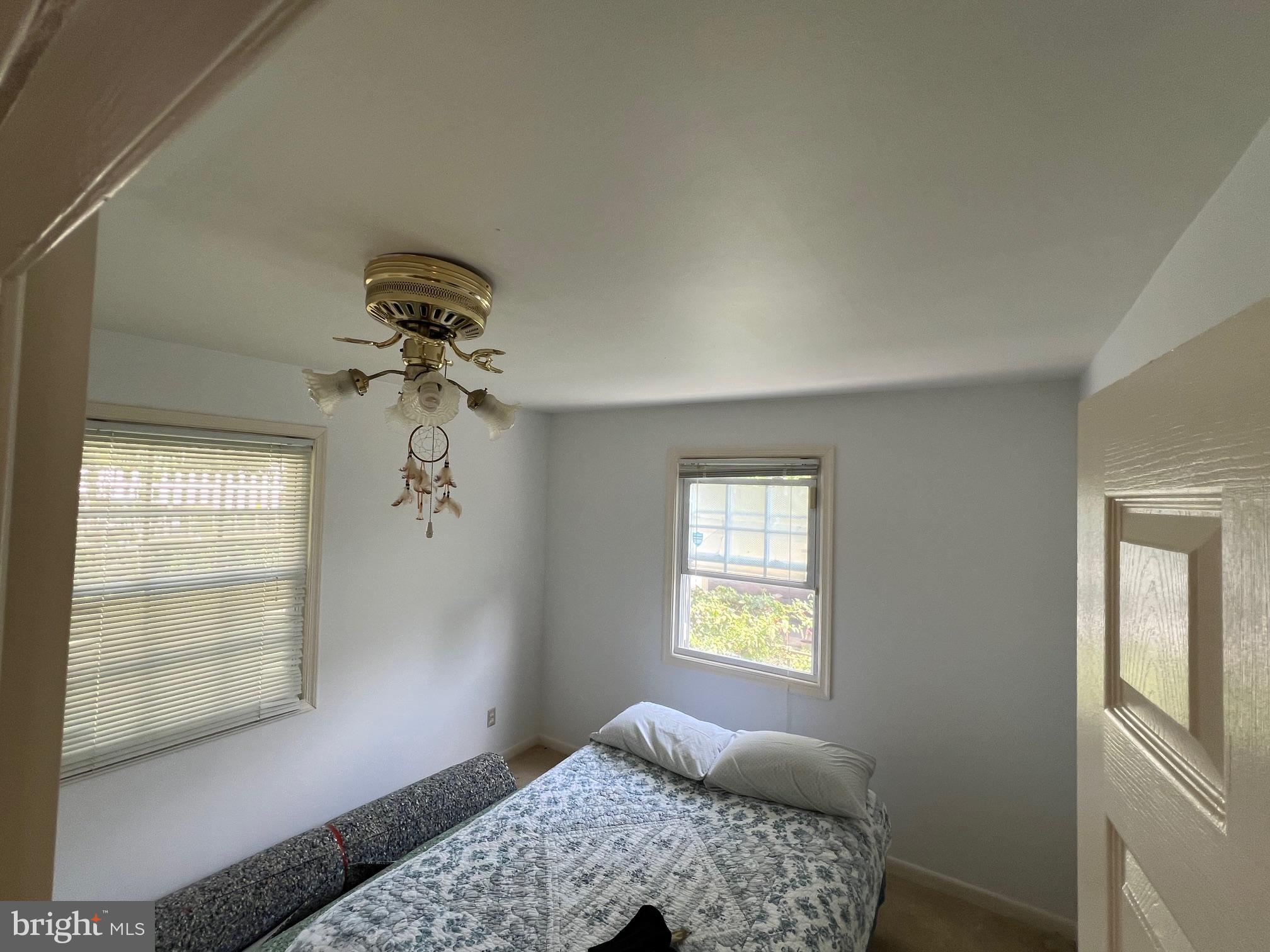 12205 Goodhill Road Silver Spring, MD 20902 - Photo 13 of 35 a bedroom with a bed and a window