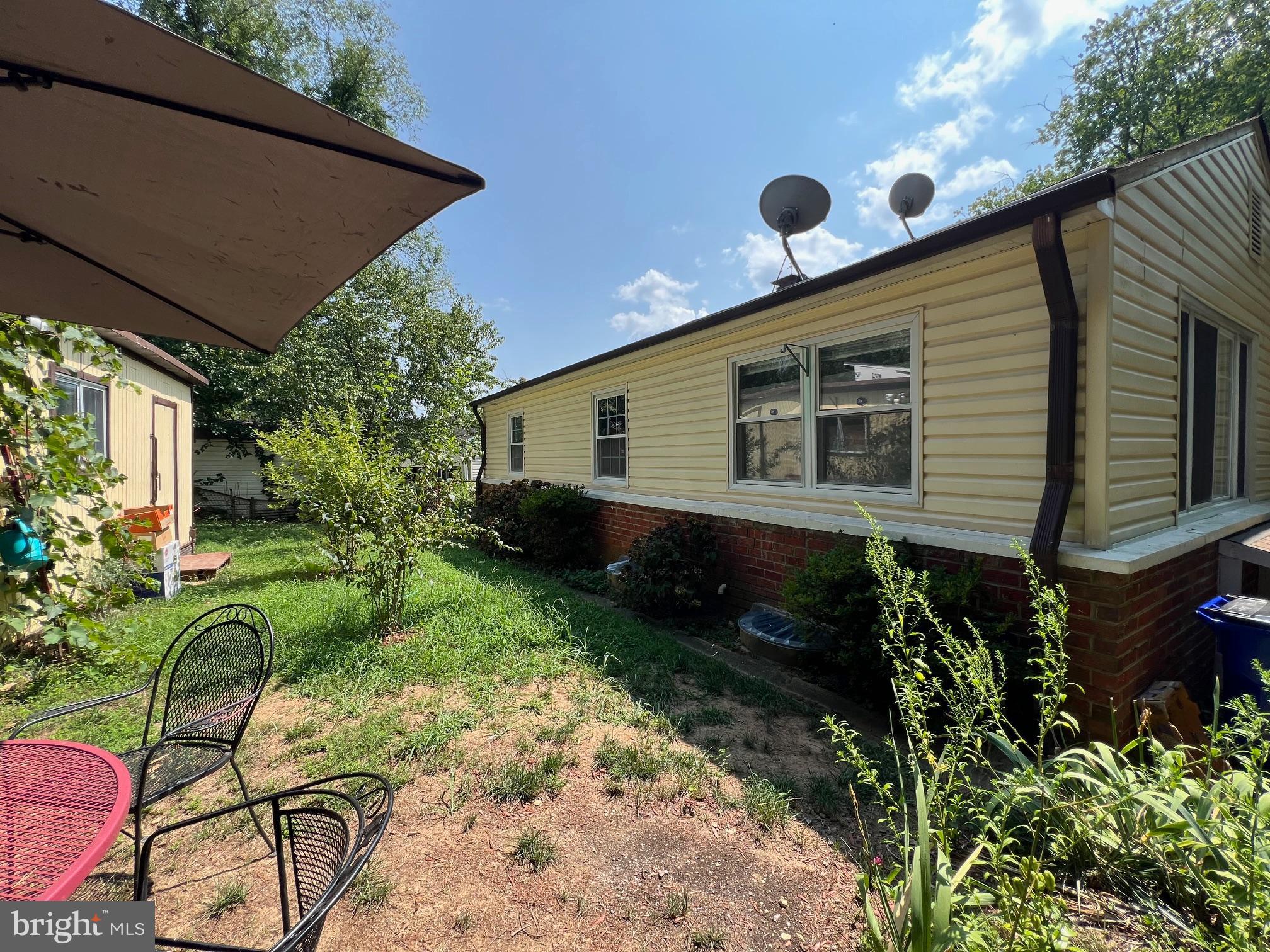 12205 Goodhill Road Silver Spring, MD 20902 - Photo 18 of 35 a backyard of a house with lots of green space
