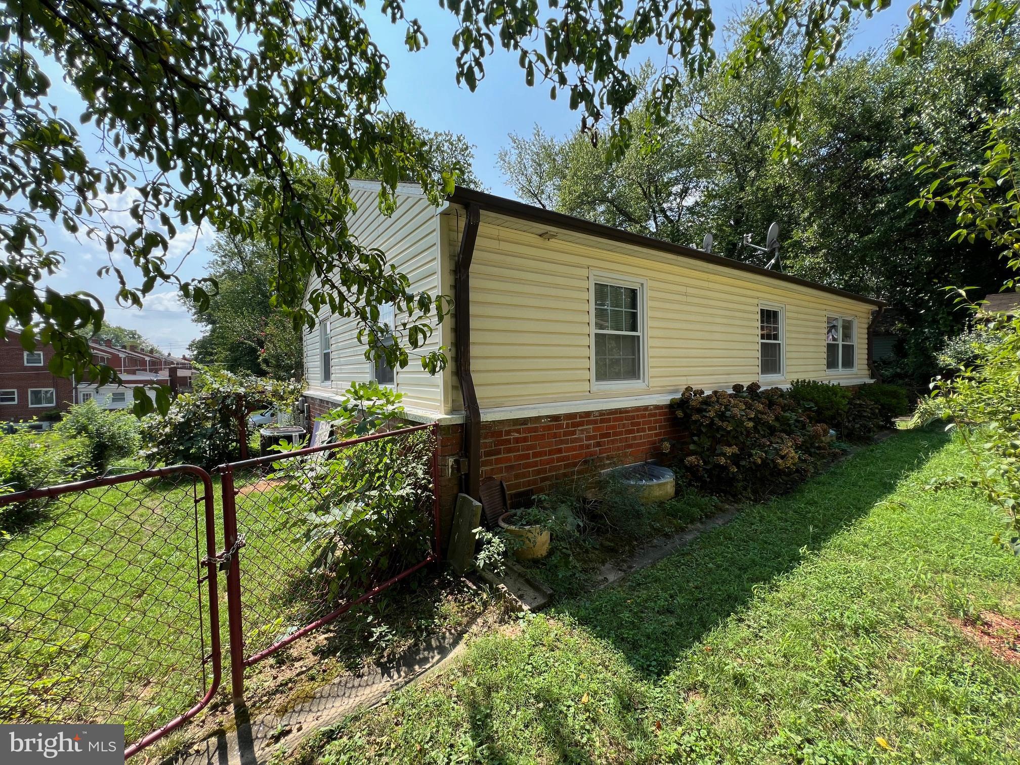 12205 Goodhill Road Silver Spring, MD 20902 - Photo 20 of 35 a backyard of a house with lots of green space