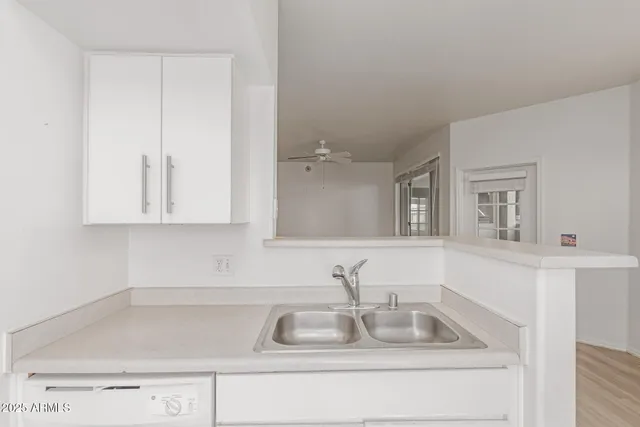 a bathroom with a sink and vanity