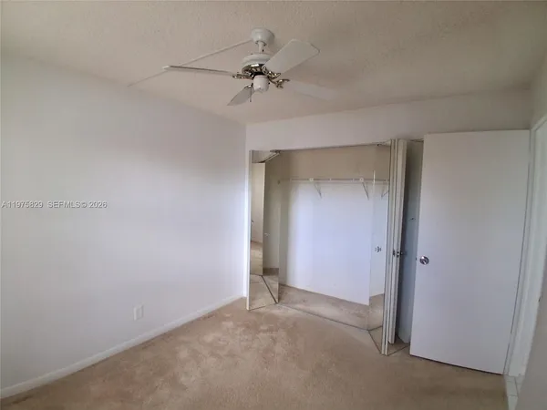 a bathroom with a shower and a toilet