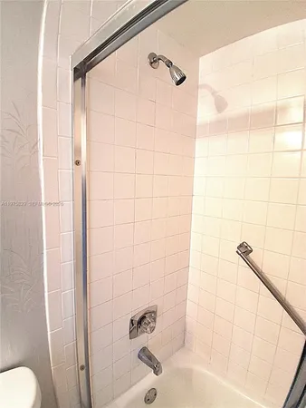 a kitchen with granite countertop a sink and a window