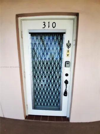 a dining room with furniture and entryway
