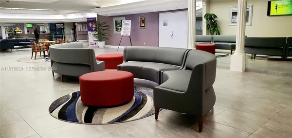 a room with a table chairs and a walk in closet