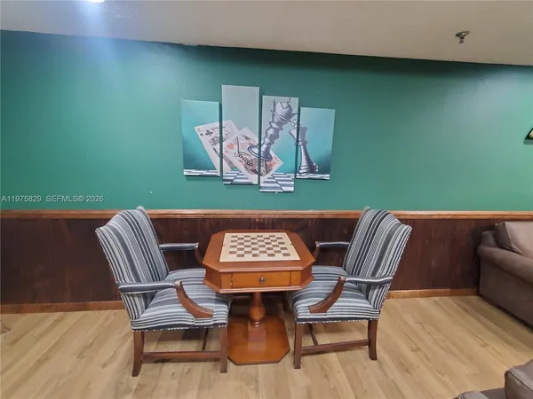 a view of a dining area with furniture and wooden floor