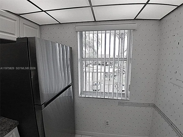 a white refrigerator freezer sitting in a kitchen