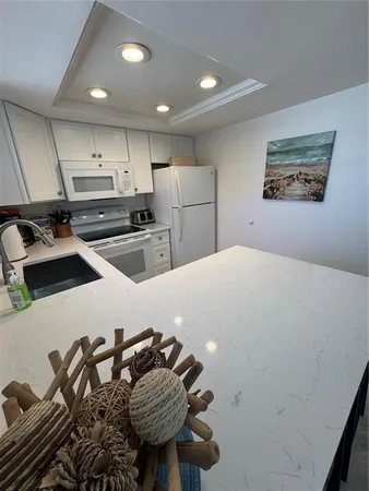 a kitchen with a sink and appliances