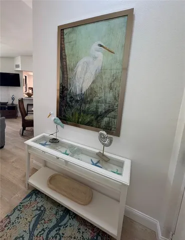 a bathroom with a granite countertop sink a mirror and vanity