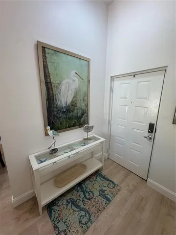 a bedroom with a bed and a mirror