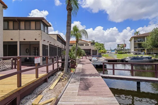 a view of a house with yard and sitting area