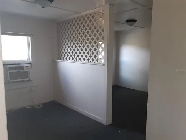 an empty room with a wooden door