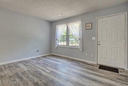 24 Sanders Road Wilmington, NC 28412 - Photo 12 of 28 New windows flood the space with light.