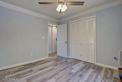 24 Sanders Road Wilmington, NC 28412 - Photo 16 of 28 Primary bedroom across from bathroom.