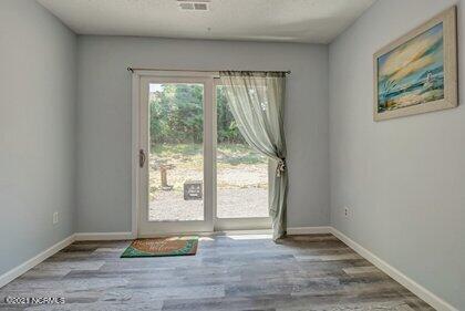 24 Sanders Road Wilmington, NC 28412 - Photo 21 of 28 Sliders lead to rear crushed stone patio...