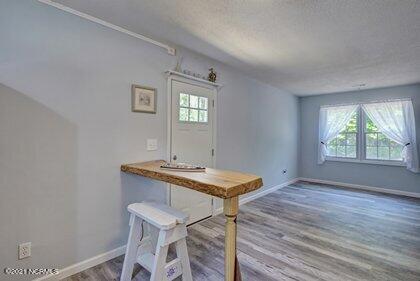 24 Sanders Road Wilmington, NC 28412 - Photo 7 of 28 Open living/dining area with a beachy/nautical flair.