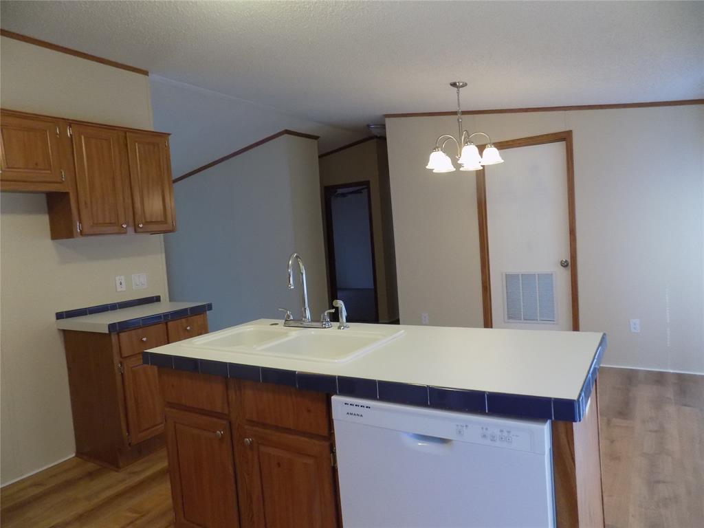 3450 Sarra Lane Springtown, TX 76082 - Photo 7 of 23 View from kitchen into dining area.