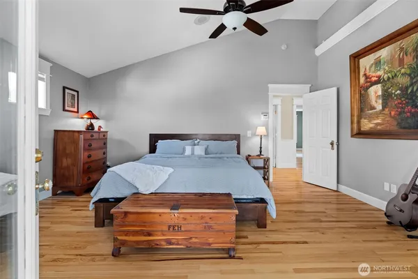 a spacious bedroom with a large bed and a window